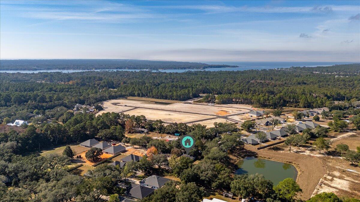 3562 Bob Tolbert Road Navarre, FL 32566 - Photo 54 of 55 an aerial view of residential houses with outdoor space