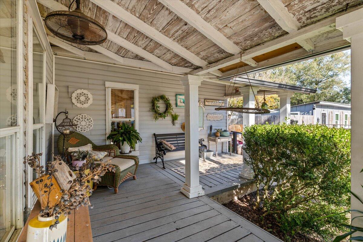 3562 Bob Tolbert Road Navarre, FL 32566 - Photo 6 of 55 a view of a porch with wooden floor