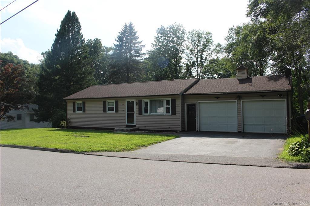 220 County Road Torrington, CT 06790 - Photo 1 of 1 a front view of a house with a yard and garage