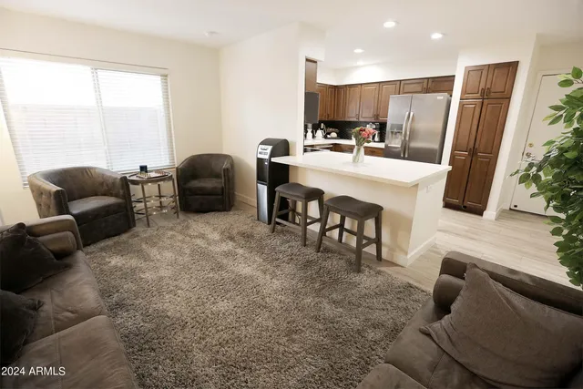 a view of a dining room with furniture and chandelier