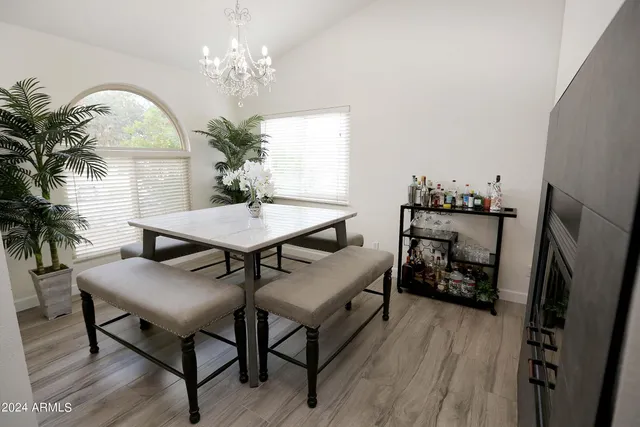 a bedroom with a bed and a mirror