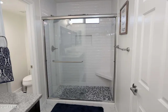 a bathroom with a white toilet