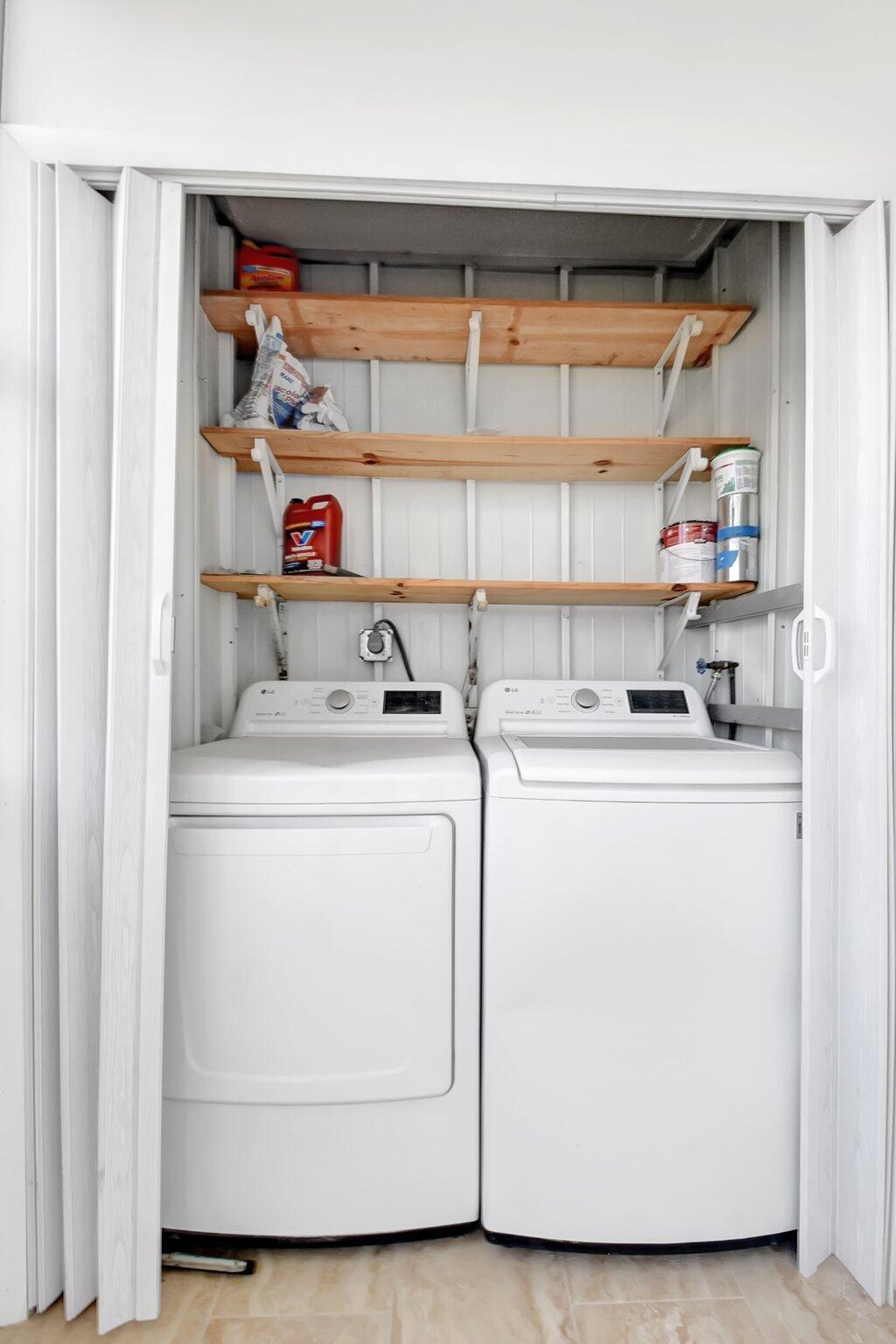 21 Brittany F, Unit A Delray Beach, FL 33446 - Photo 20 of 41 a utility room with dryer and washer