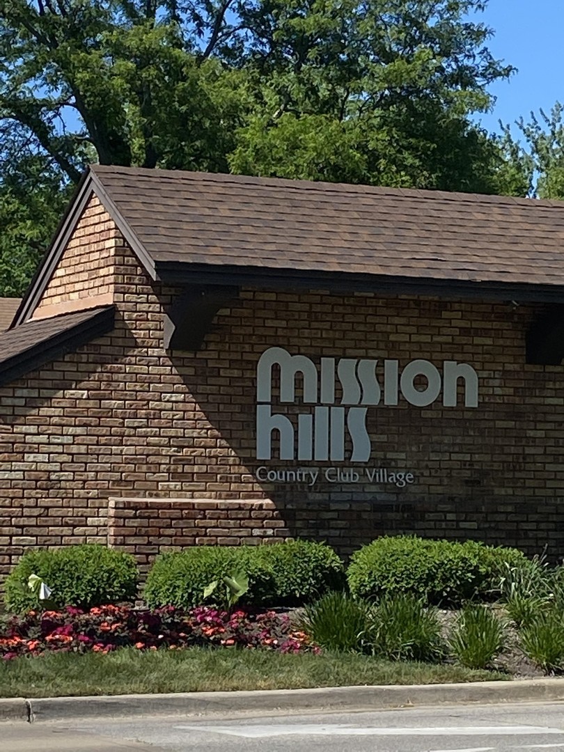 1800 Mission Hills Road, Unit 210 Northbrook, IL 60062 - Photo 15 of 16 a view of house with yard and garage