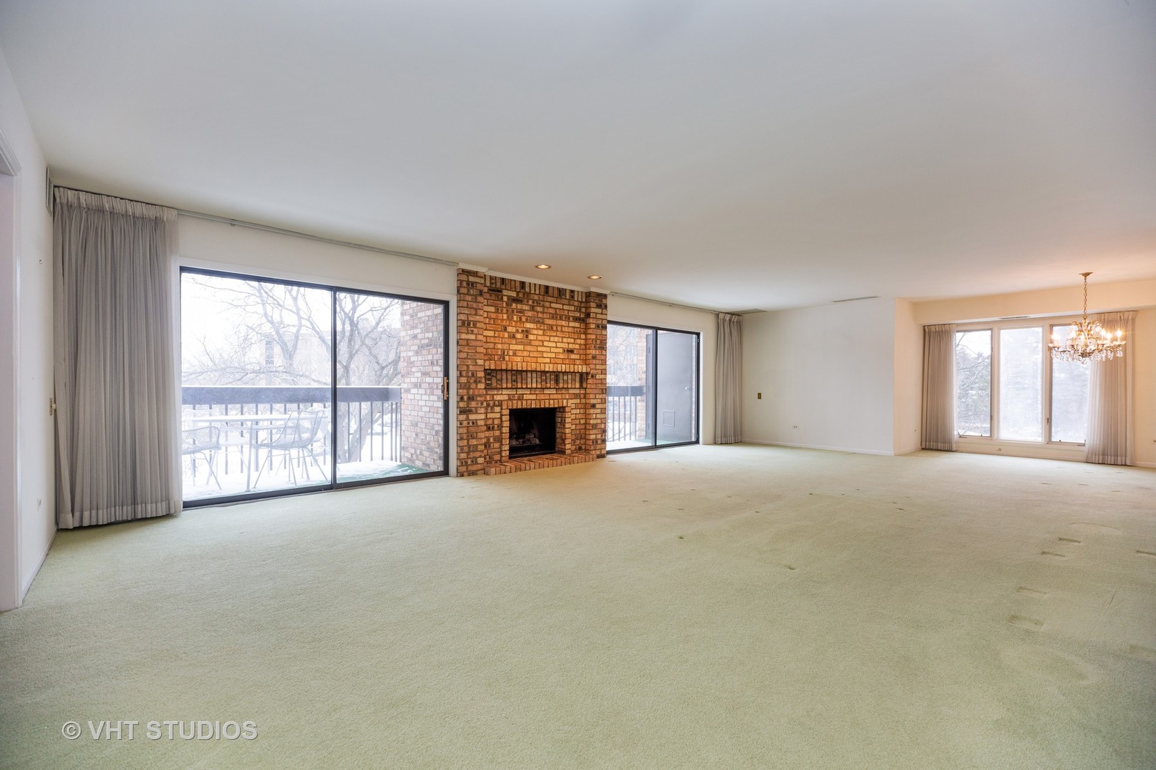 1800 Mission Hills Road, Unit 210 Northbrook, IL 60062 - Photo 5 of 16 a view of empty room with windows and fireplace