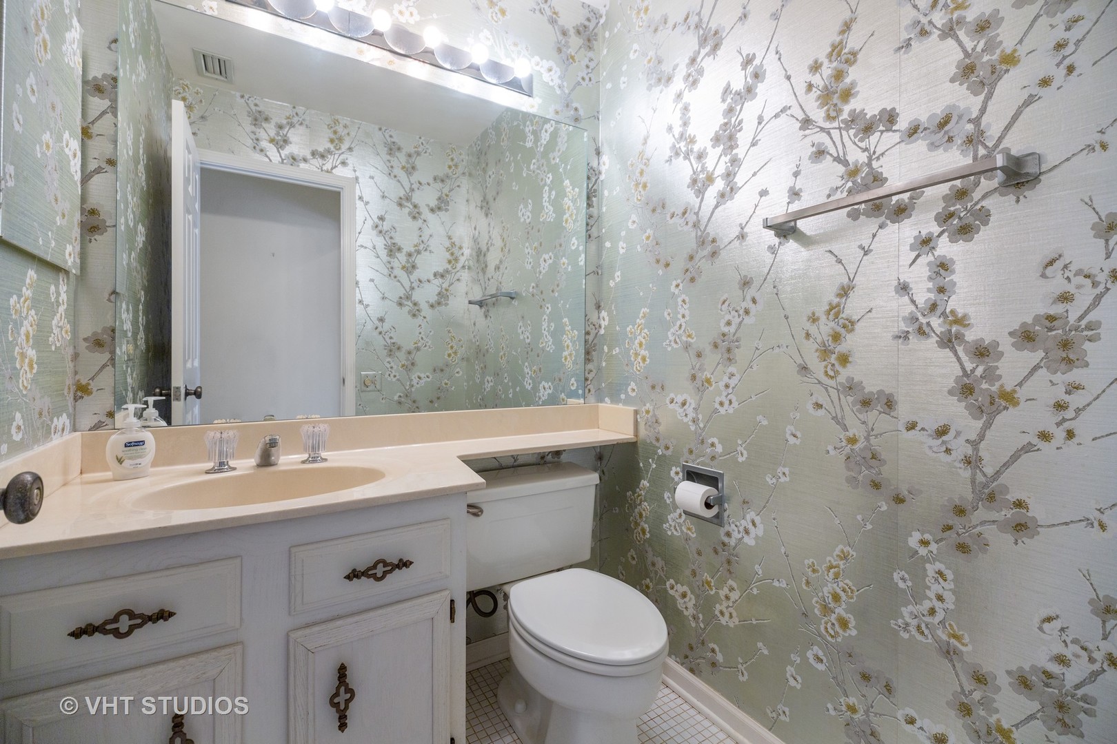 1800 Mission Hills Road, Unit 210 Northbrook, IL 60062 - Photo 8 of 16 a bathroom with a granite countertop sink mirror vanity and toilet