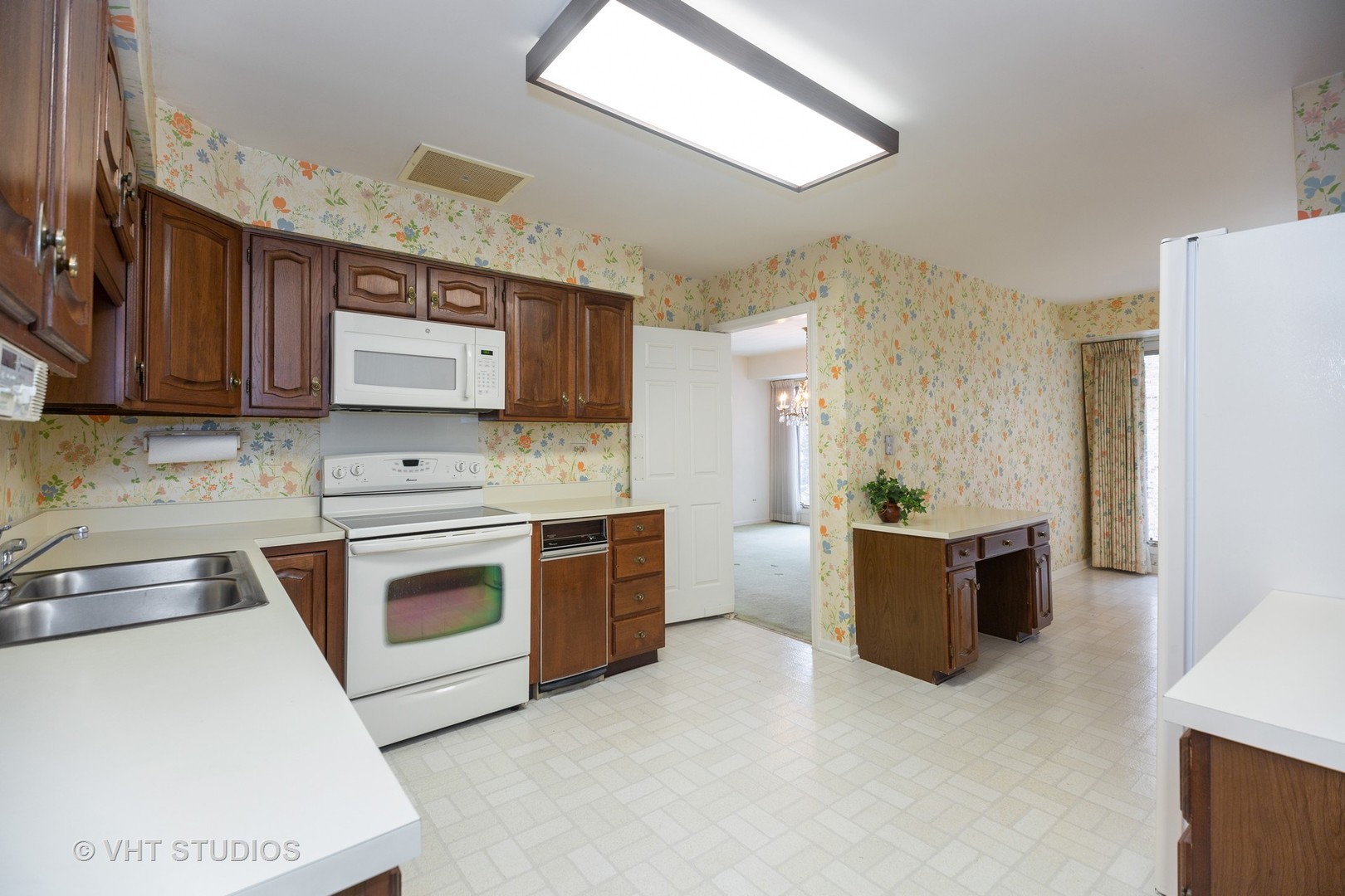 1800 Mission Hills Road, Unit 210 Northbrook, IL 60062 - Photo 10 of 16 a kitchen with stainless steel appliances granite countertop a sink stove and refrigerator