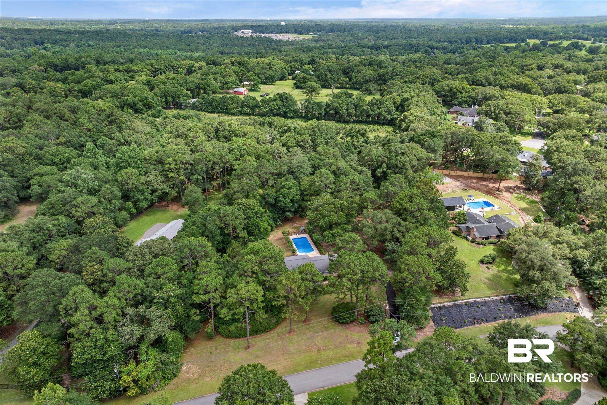 8301 Fordham Road Mobile, AL 36619 - Photo 42 of 57 Expansive wooded landscape featuring multiple properties, each with a private swimming pool