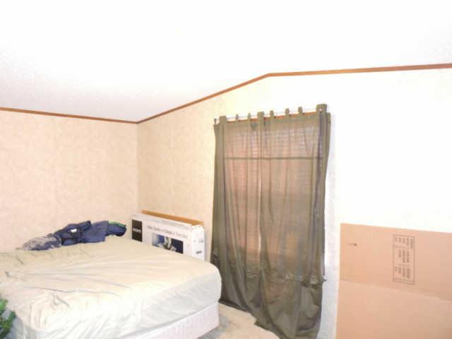 8260 Fredonia Road Manchester, TN 37355 - Photo 8 of 11 a bedroom with a bed and a window