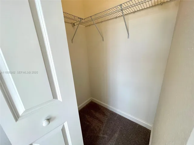 a view of a house with swimming pool and sitting area