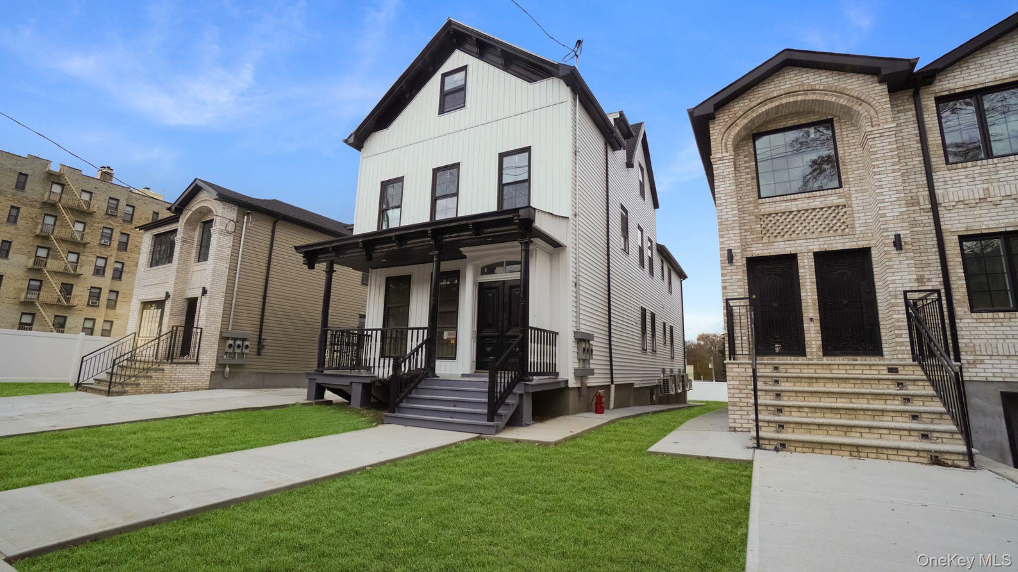 340 East 234th Street Bronx, NY 10470 - Photo 2 of 14 a view of a house with a yard