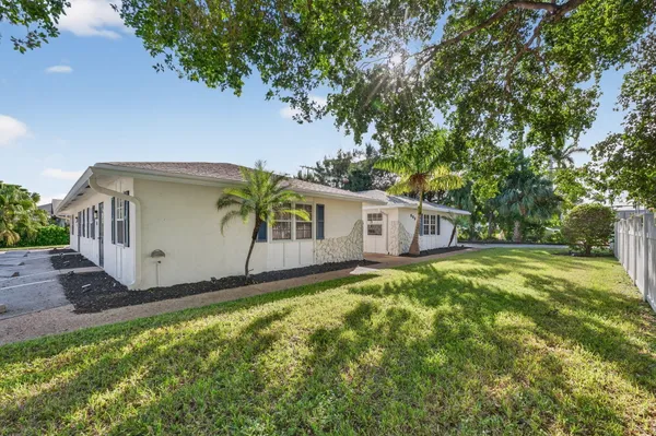 a view of a dining room with furniture wooden floor and a chandelier