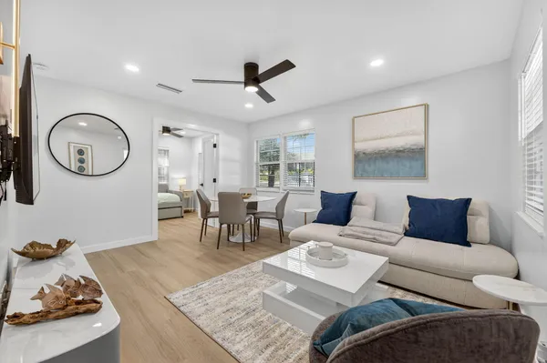 a view of a dining room with furniture window and wooden floor