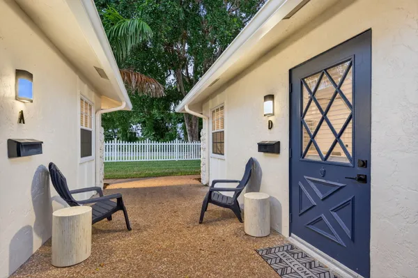 a front view of a house with a yard and a garage