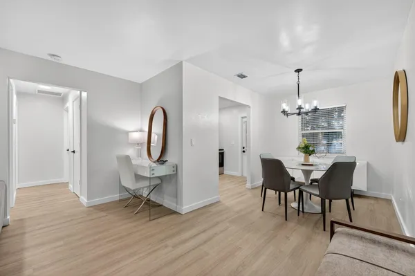 an aerial view of residential house with an outdoor space and seating