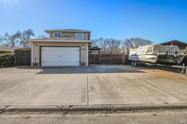 a view of a car parked in front of a house