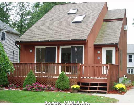 56 Hillcrest Road East Lyme, CT 06357 - Photo 1 of 1 a front view of a house with a yard