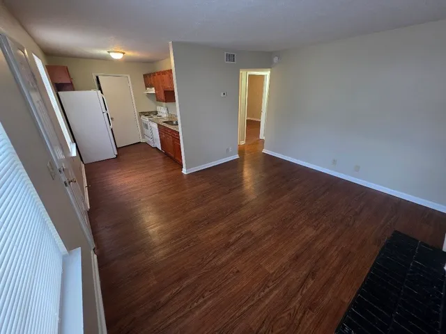 a view of livingroom with hardwood and window