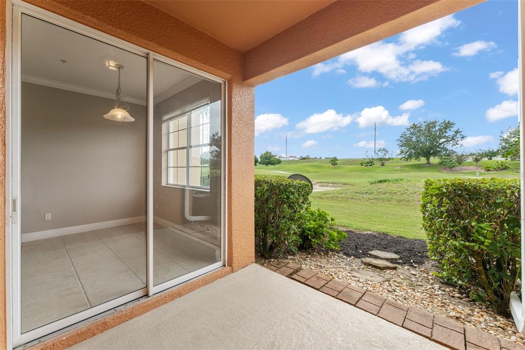 868 Assembly Court Reunion, FL 34747 - Photo 19 of 43 a view of a glass door and an outdoor space