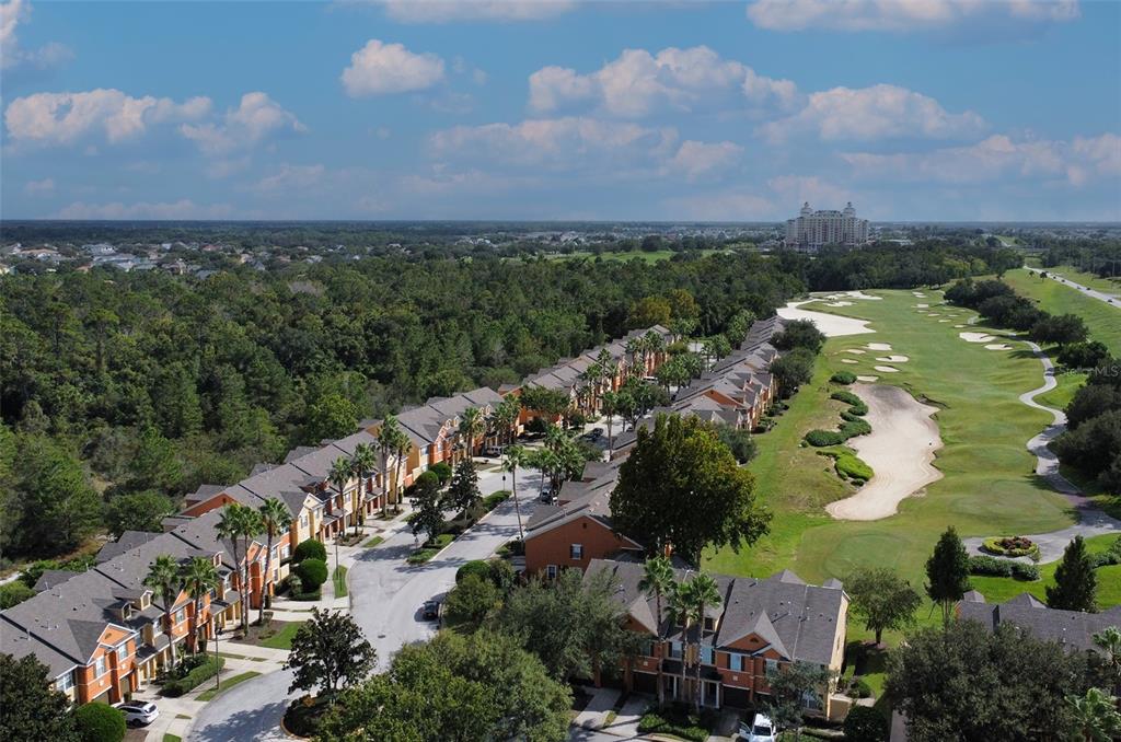 868 Assembly Court Reunion, FL 34747 - Photo 2 of 43 an aerial view of a city with lots of residential buildings ocean and mountain view in back