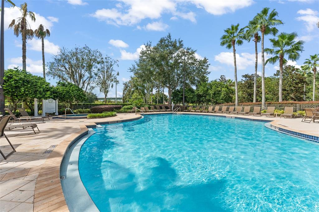 868 Assembly Court Reunion, FL 34747 - Photo 35 of 43 a view of a swimming pool with a yard and palm trees