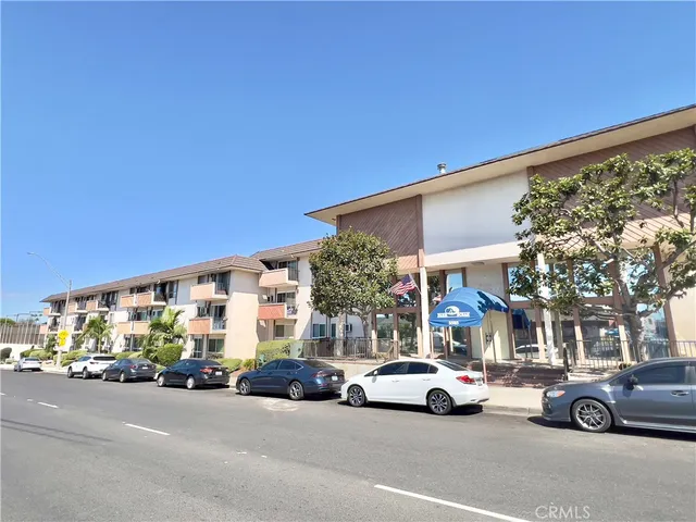 a view of car parked in front of a building