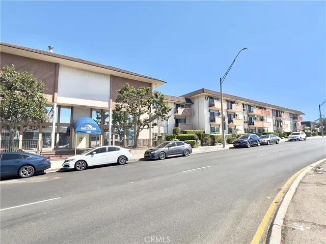 a view of a cars parked in front of a building