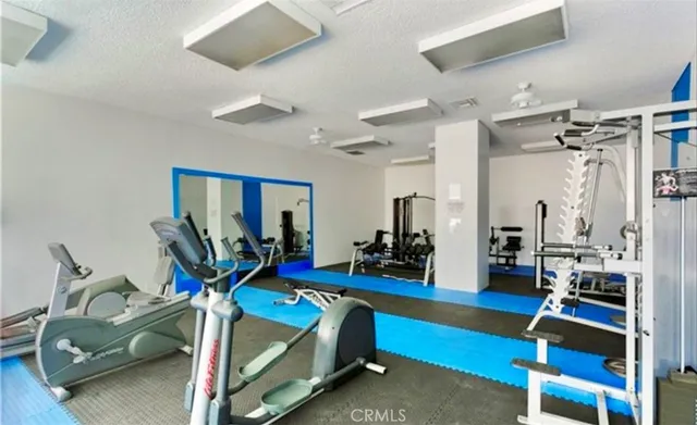 a view of a swimming pool and lounge chairs