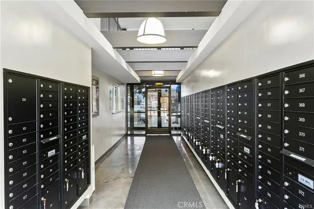 a work room with furniture and a flat screen tv