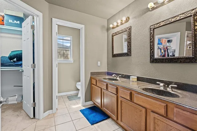 a room with a sink and a mirror