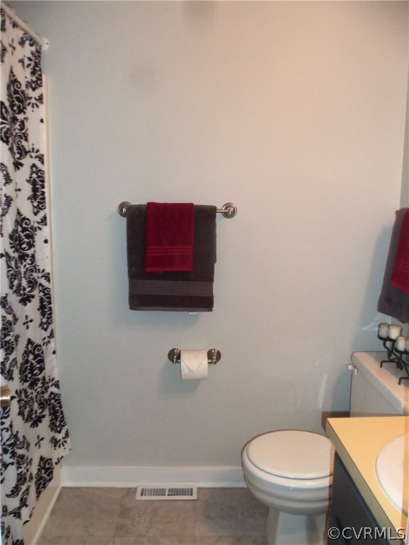 2906 Brookforest Road Midlothian, VA 23112 - Photo 11 of 13 a bathroom with a toilet a sink and a mirror