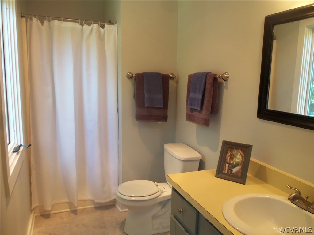 2906 Brookforest Road Midlothian, VA 23112 - Photo 9 of 13 a bathroom with a sink toilet and shower