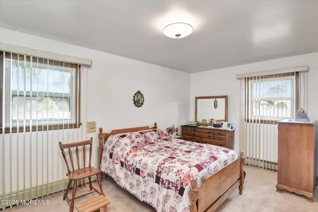 a bedroom with a bed and flat screen tv