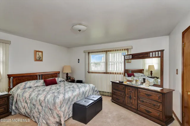 a bathroom with a sink a mirror and a shower