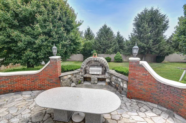 a view of a chairs and table in the patio