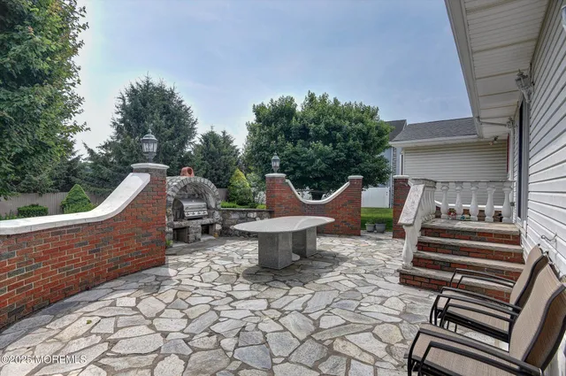 a bedroom with a bed and a large window with outer view