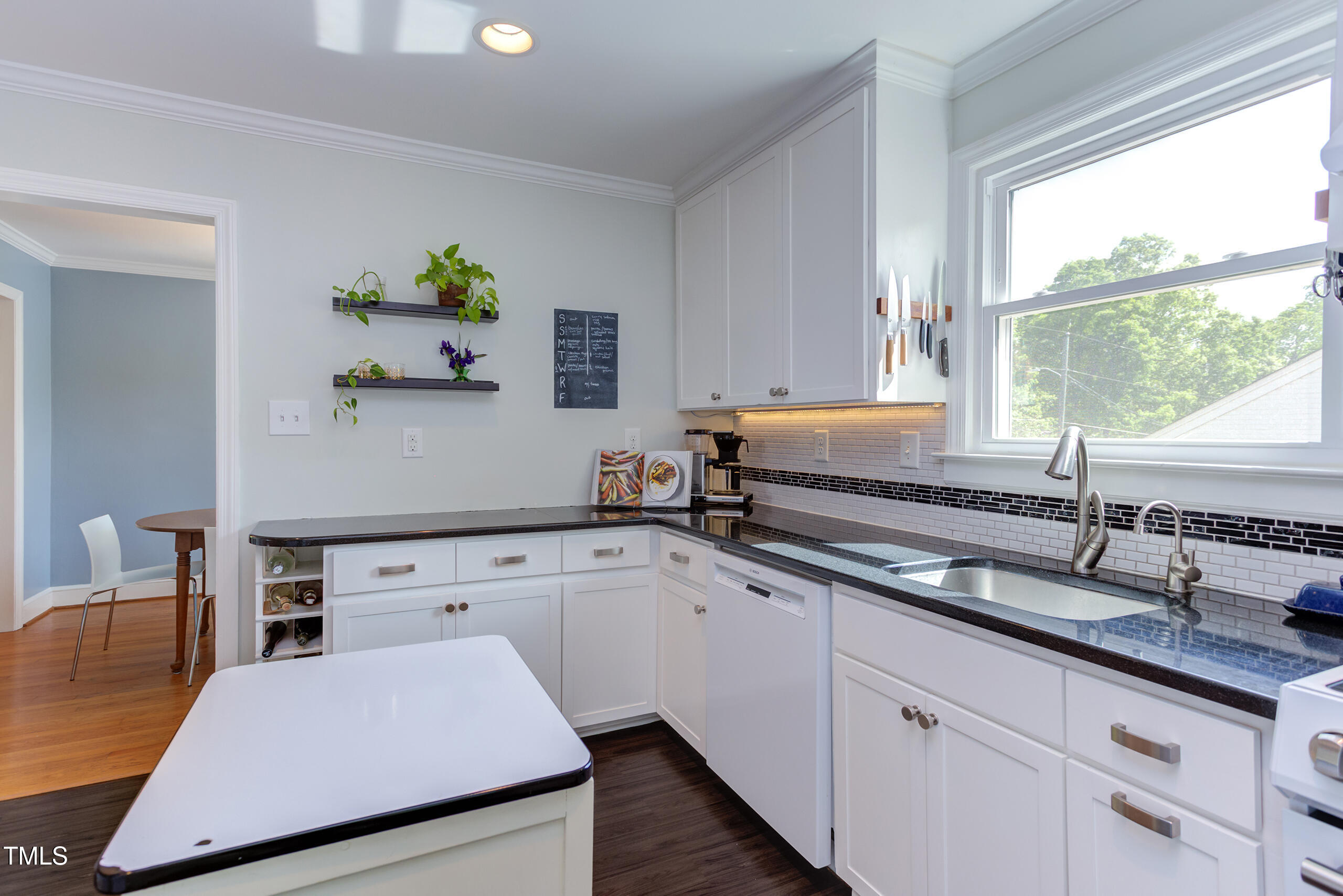 2811 Van Dyke Avenue Raleigh, NC 27607 - Photo 12 of 57 a kitchen with a sink and a window