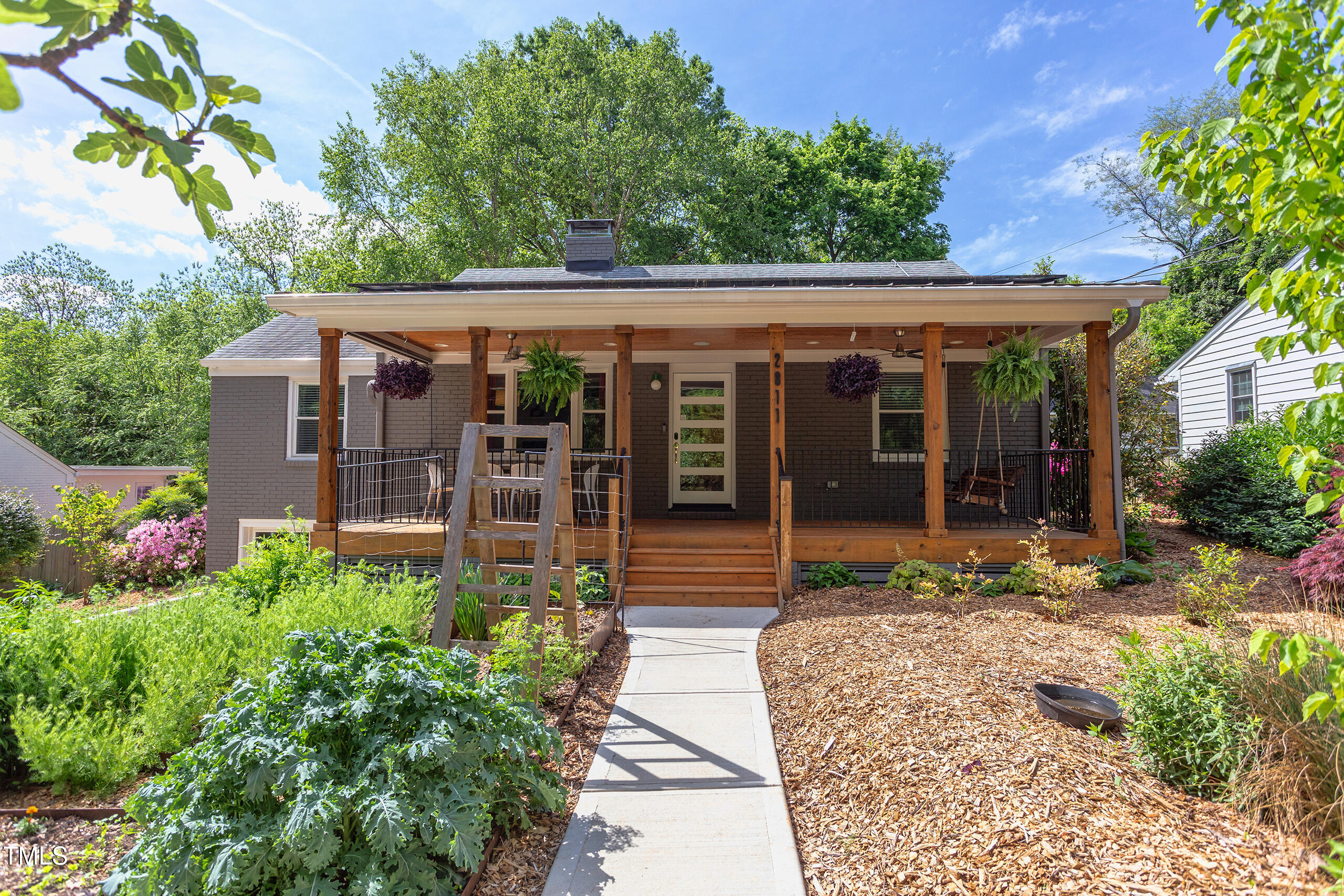 2811 Van Dyke Avenue Raleigh, NC 27607 - Photo 2 of 57 a front view of a house with a porch