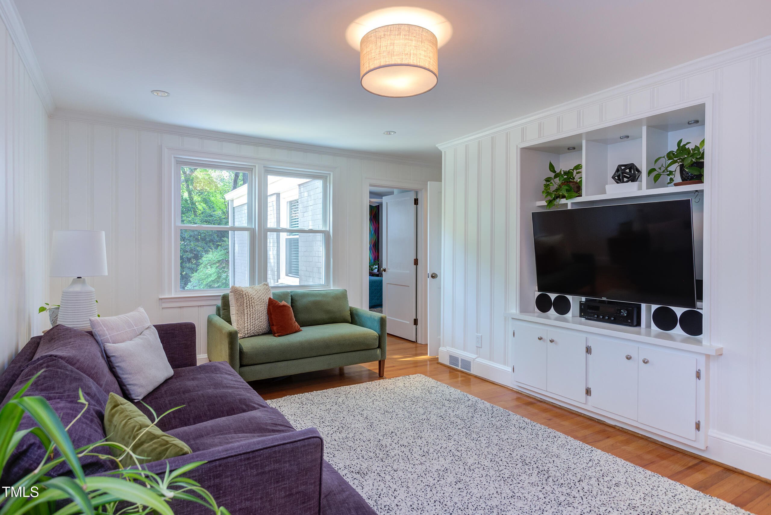 2811 Van Dyke Avenue Raleigh, NC 27607 - Photo 22 of 57 a living room with furniture and a flat screen tv