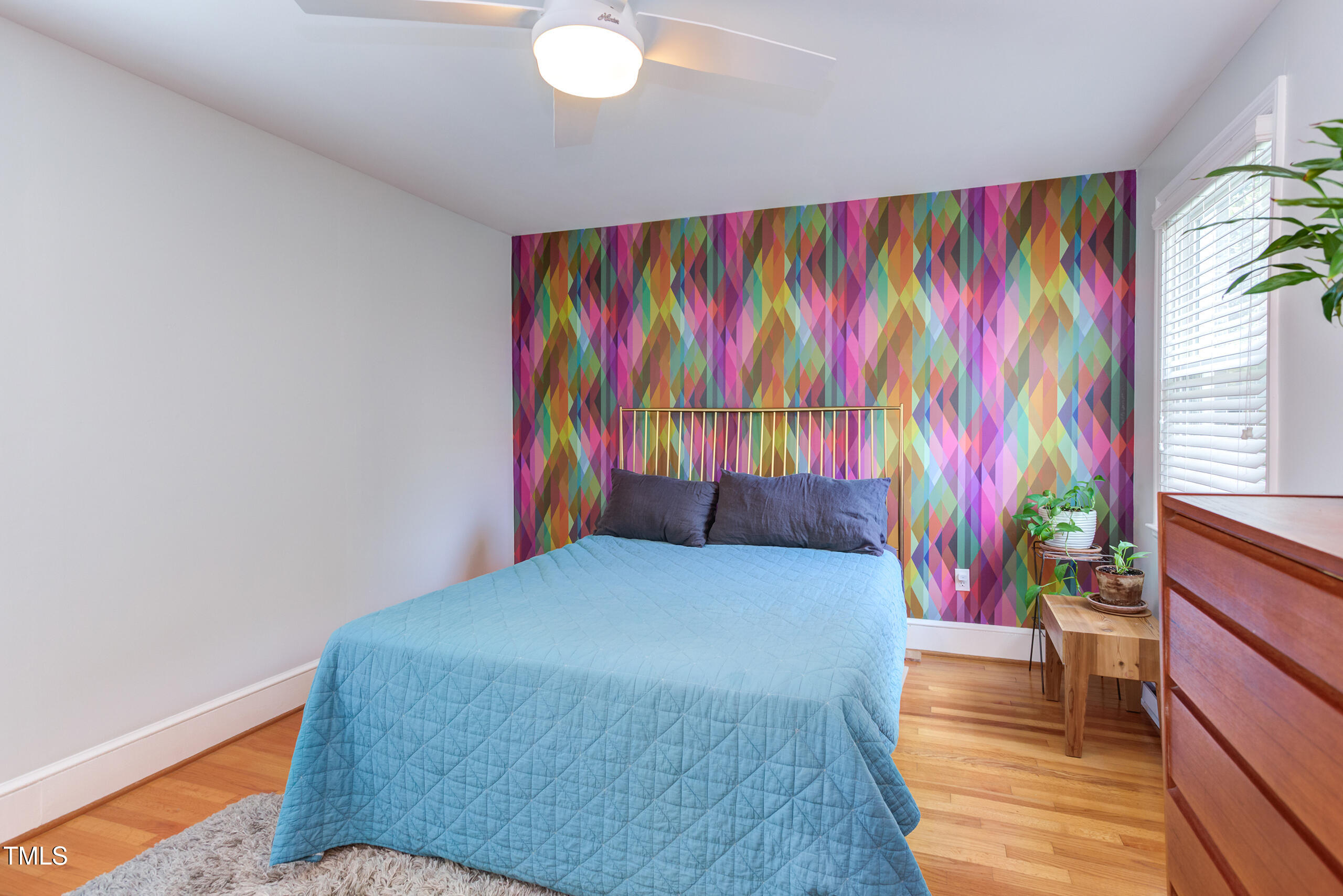 2811 Van Dyke Avenue Raleigh, NC 27607 - Photo 26 of 57 a bedroom with a bed and a painting on the wall