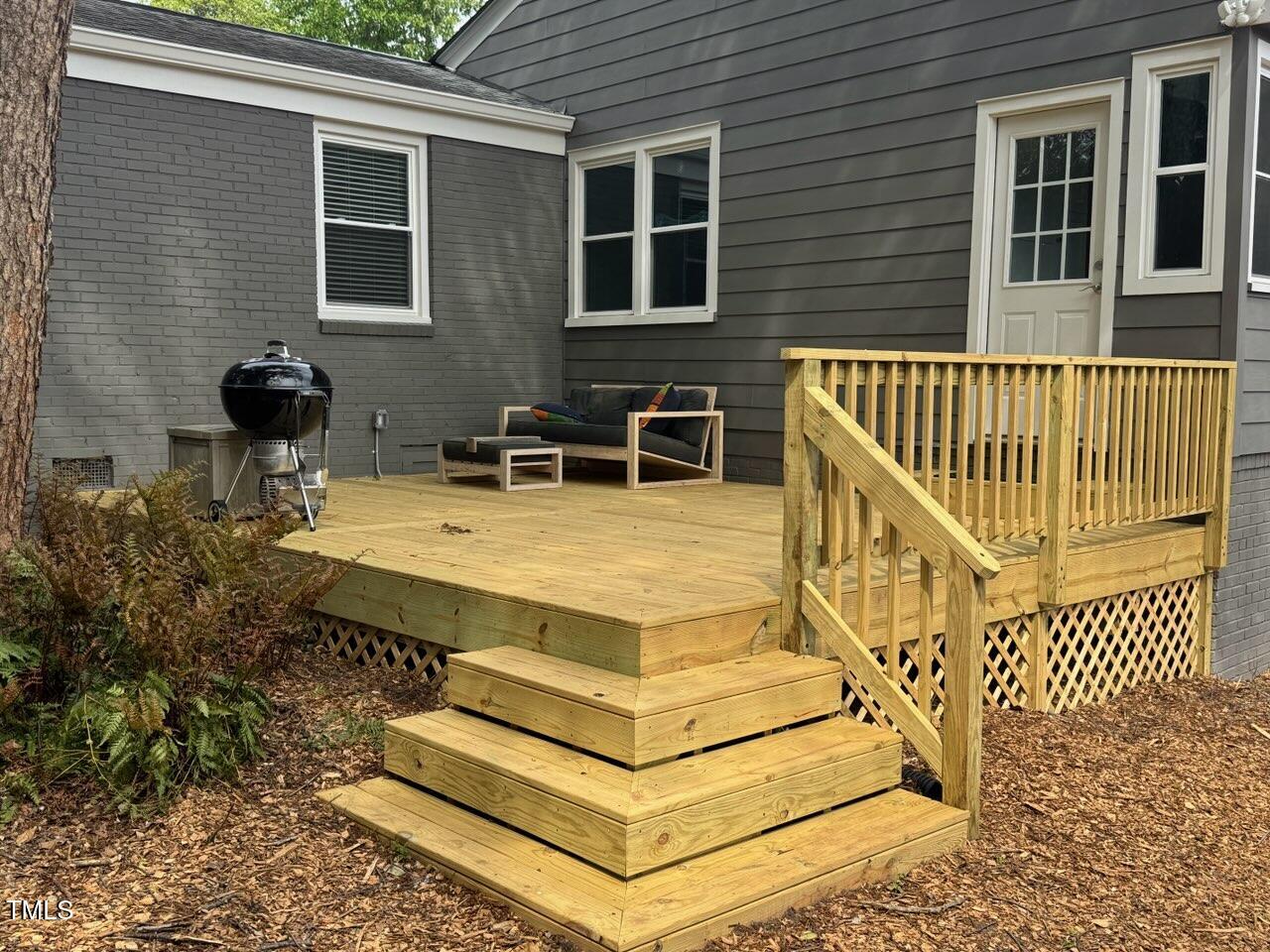 2811 Van Dyke Avenue Raleigh, NC 27607 - Photo 35 of 57 a view of house with deck and chairs
