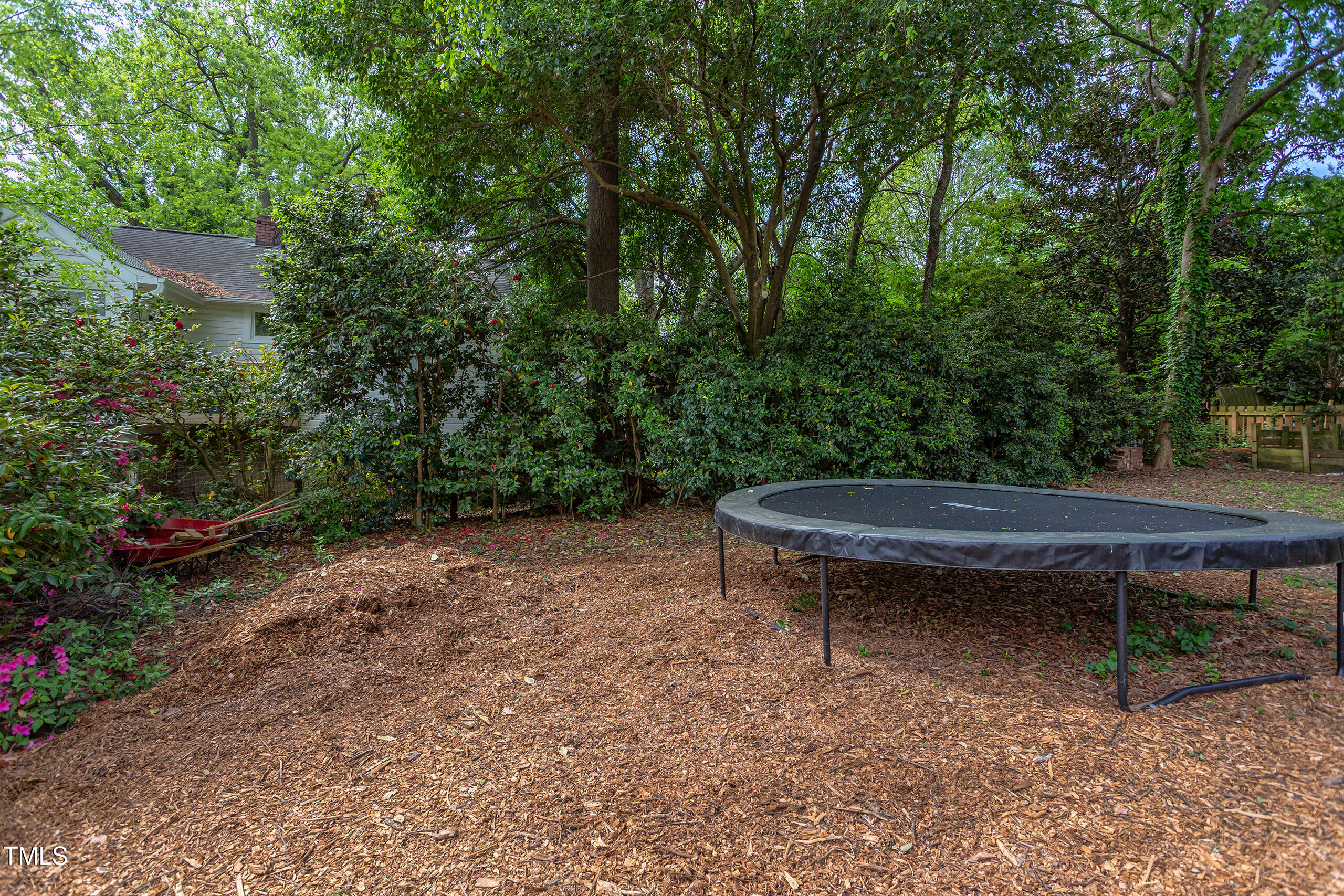 2811 Van Dyke Avenue Raleigh, NC 27607 - Photo 38 of 57 a backyard of a house with table and chairs