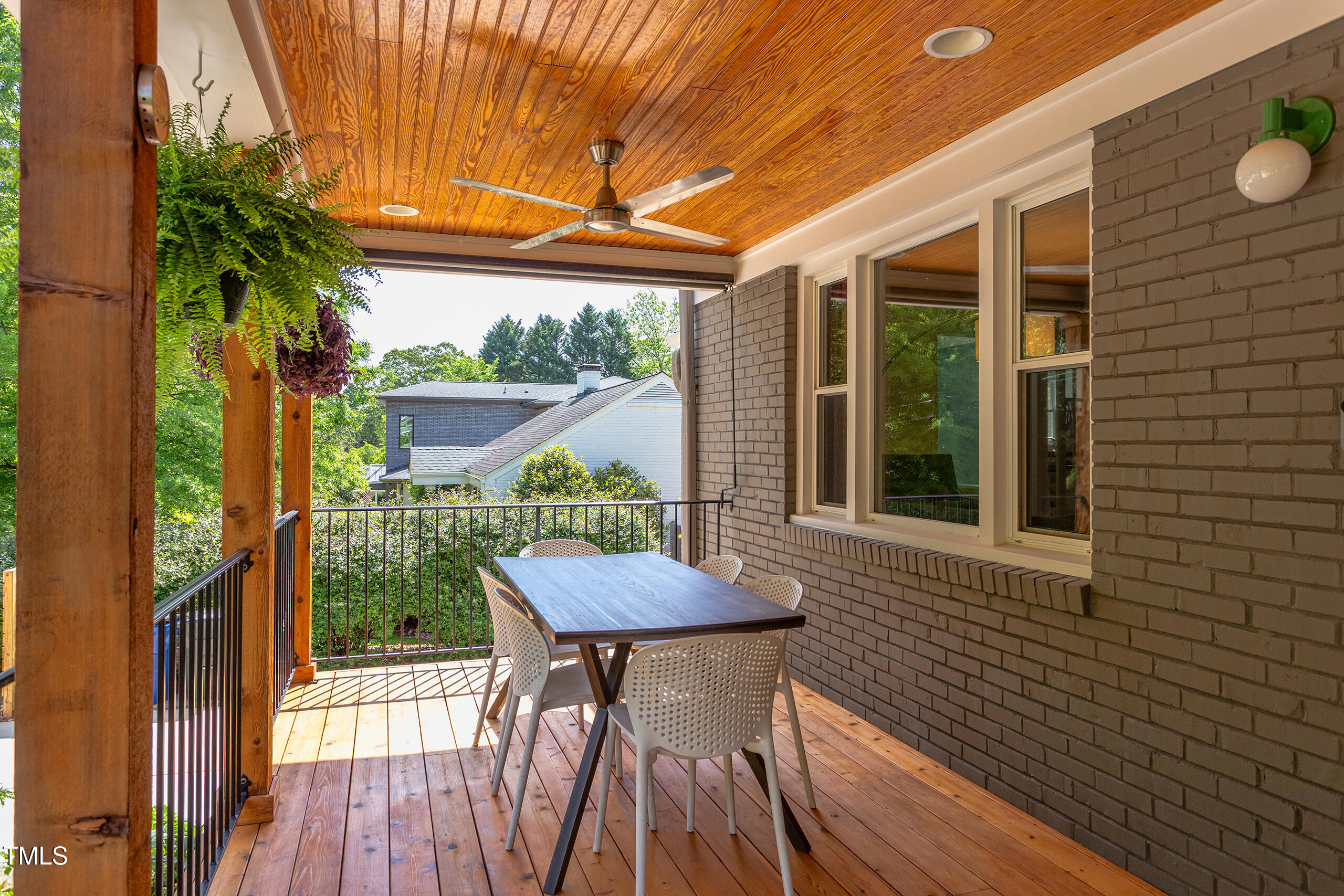 2811 Van Dyke Avenue Raleigh, NC 27607 - Photo 4 of 57 a view of a chair and table in the balcony