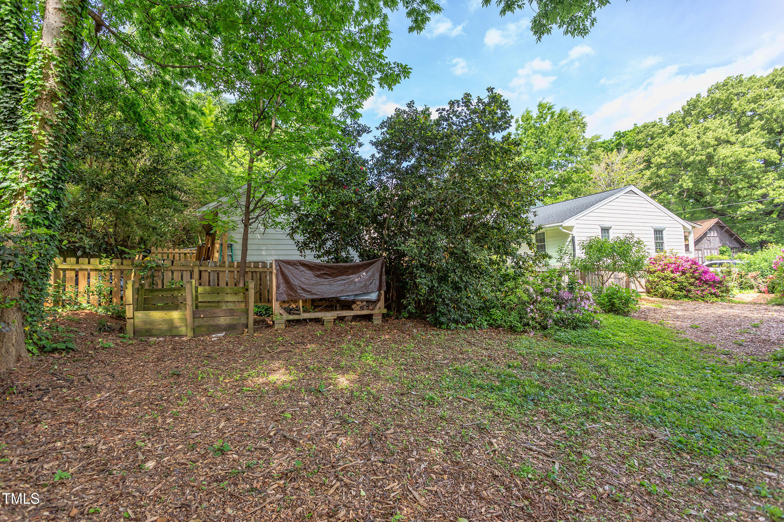 2811 Van Dyke Avenue Raleigh, NC 27607 - Photo 41 of 57 a backyard of a house with table and chairs