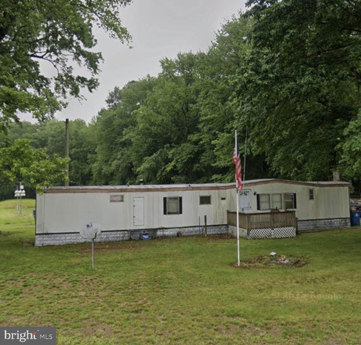 170 Sugar Stick Road Harrington, DE 19952 - Photo 1 of 1 a view of a house with a backyard