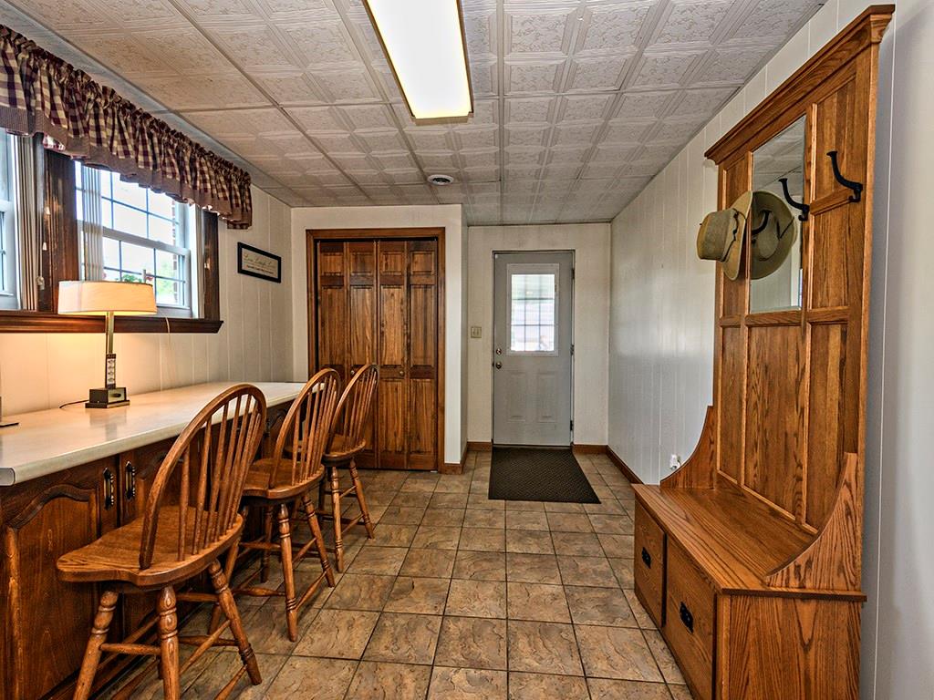 303 Kings Road Apollo, PA 15613 - Photo 12 of 24 Entry from the driveway brings you into a bonus room that has many options. Mudroom Closet is a perfect catch-all when you arrive home. The bar counter is great for crafting, doing homework, or putting together a puzzle!