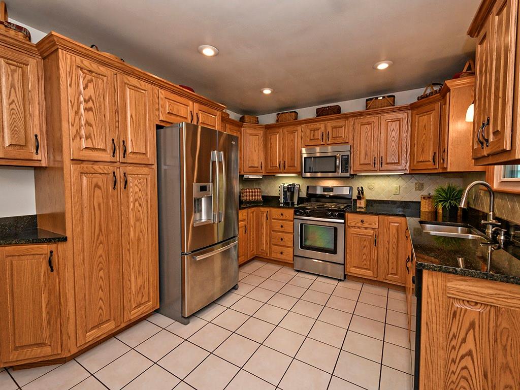 Appliances are included.  Really pretty granite countertops have warm markings and go beautifully with the warm oak cabinets.