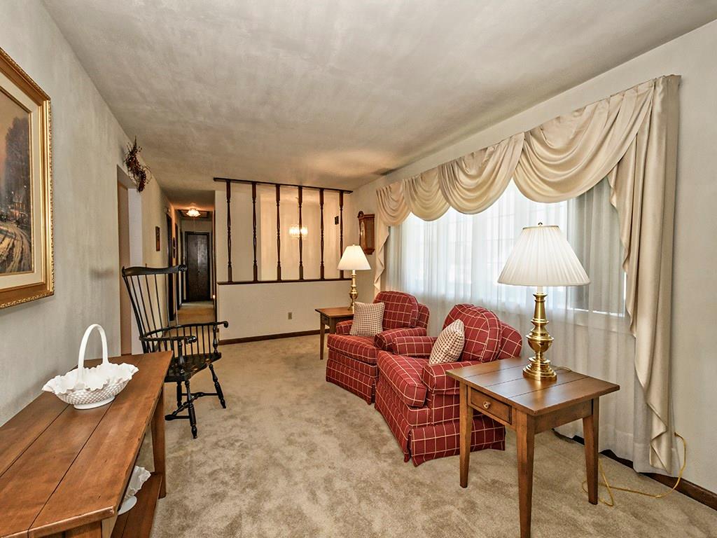 303 Kings Road Apollo, PA 15613 - Photo 9 of 24 A large bow window allows for natural light to fill the formal living room.