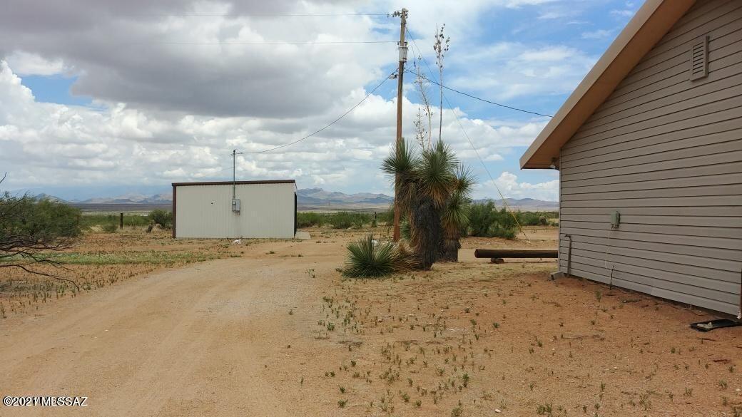 3440 East Howling Wolf Road Willcox, AZ 85643 - Photo 26 of 45 a view of a dry yard with a tree