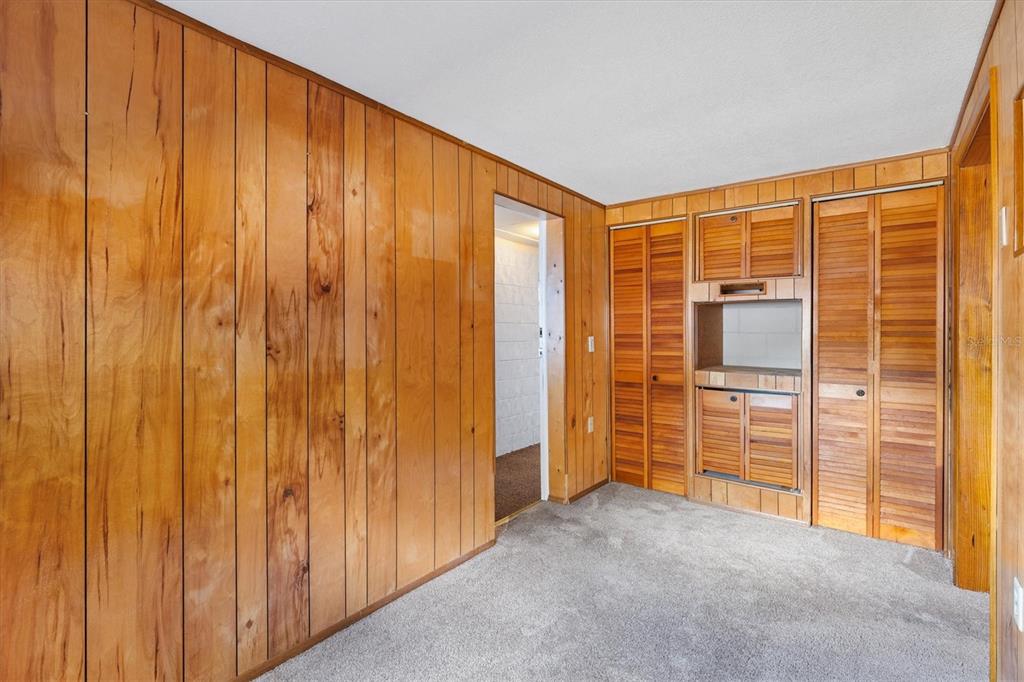 5605 Berts Road Lady Lake, FL 32159 - Photo 24 of 38 a view of a room with walk in closet and cabinet
